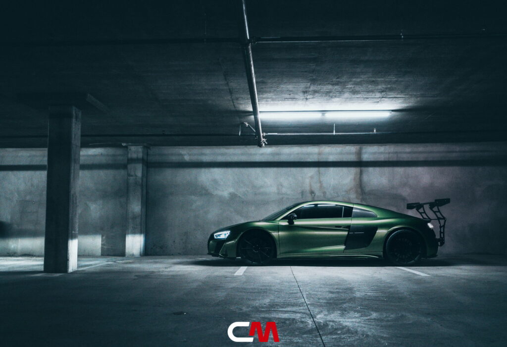 Green Audi R8 V10 with a carbon fiber hood and custom rear wing fitted by California Motorsports