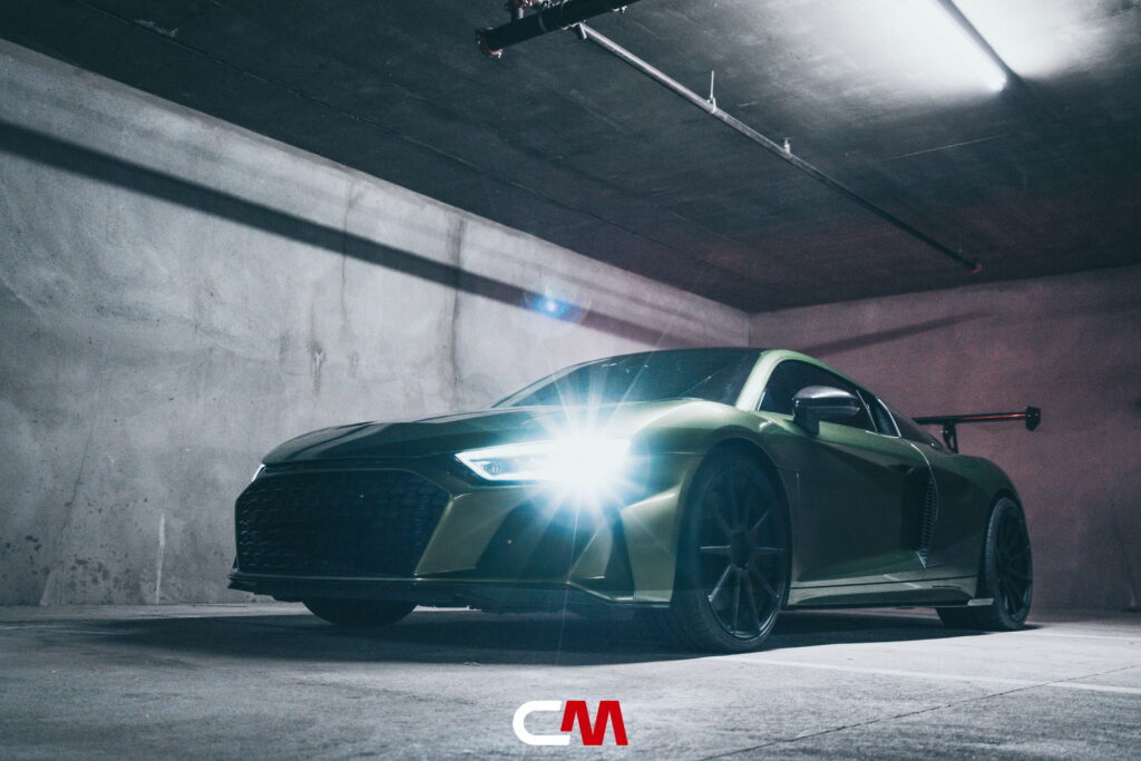 Green Audi R8 V10 with a carbon fiber hood and custom rear wing fitted by California Motorsports
