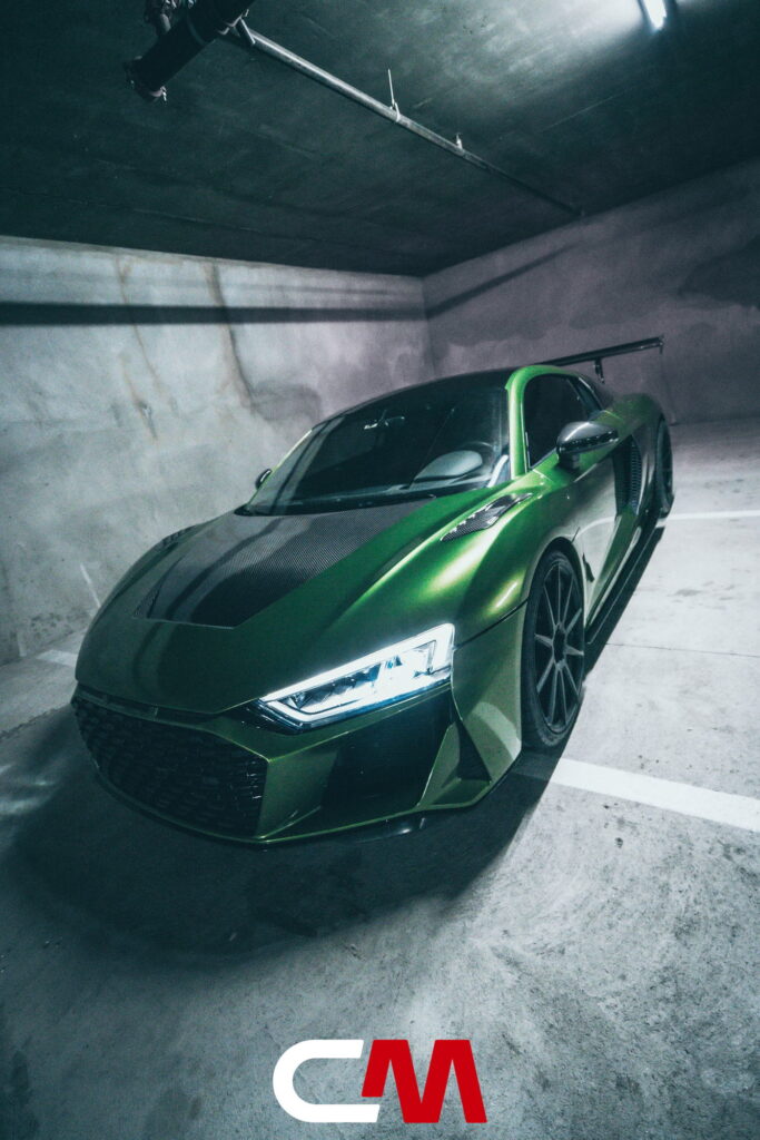 Green Audi R8 V10 with a carbon fiber hood and custom rear wing fitted by California Motorsports