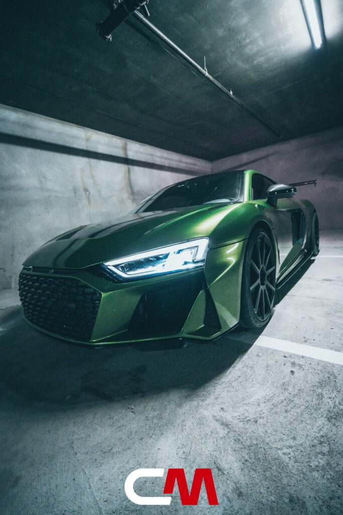Green Audi R8 V10 with a carbon fiber hood and custom rear wing fitted by California Motorsports