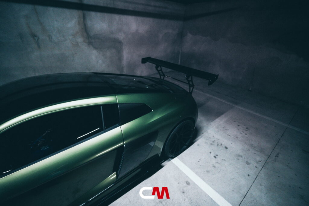 Green Audi R8 V10 with a carbon fiber hood and custom rear wing fitted by California Motorsports