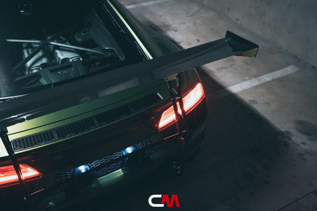 Green Audi R8 V10 with a carbon fiber hood and custom rear wing fitted by California Motorsports
