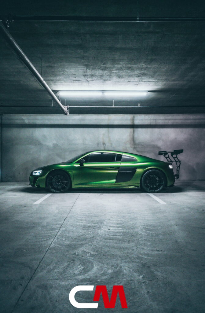 Green Audi R8 V10 with a carbon fiber hood and custom rear wing fitted by California Motorsports