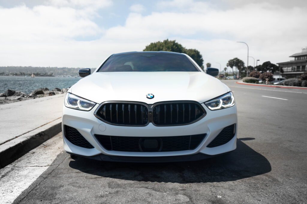 BMW M850i in a Satin Flip Ghost Pearl color-change wrap with H&R lowering springs by California Motorsports