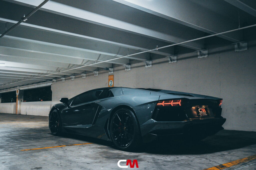 Lamborghini Aventador in a Nardo Gray color-change wrap with black wheels by California Motorsports