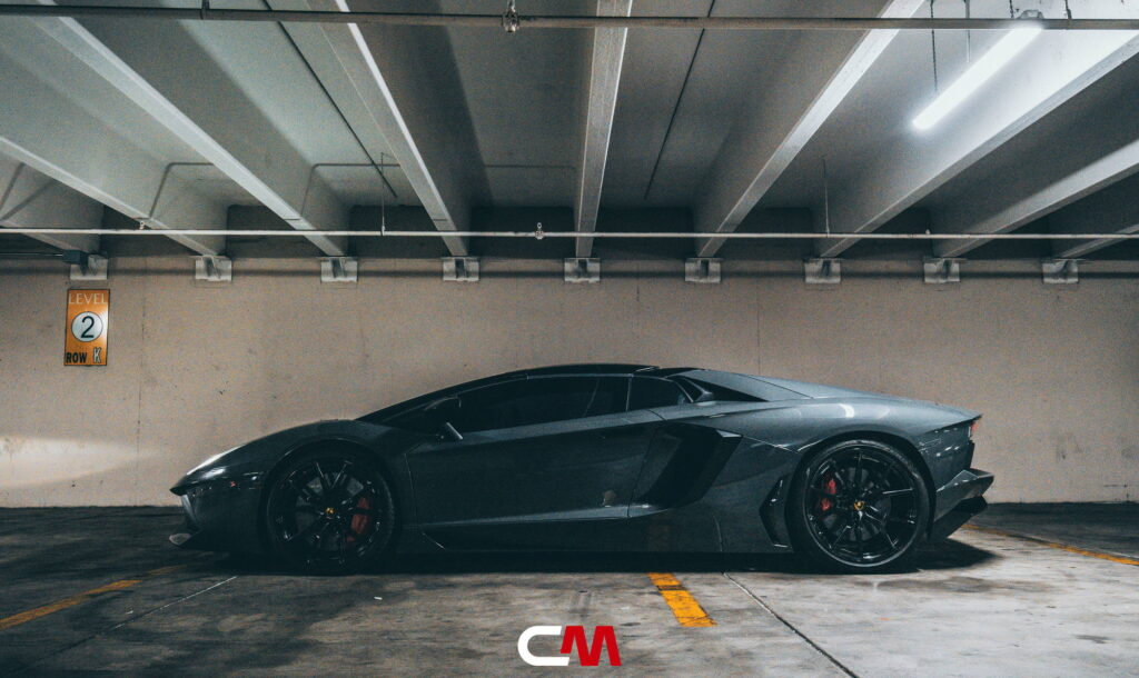 Lamborghini Aventador in a Nardo Gray color-change wrap with black wheels by California Motorsports