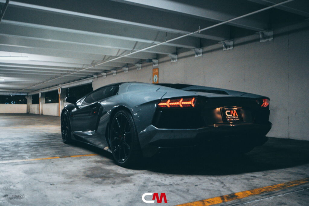 Lamborghini Aventador in a Nardo Gray color-change wrap with black wheels by California Motorsports