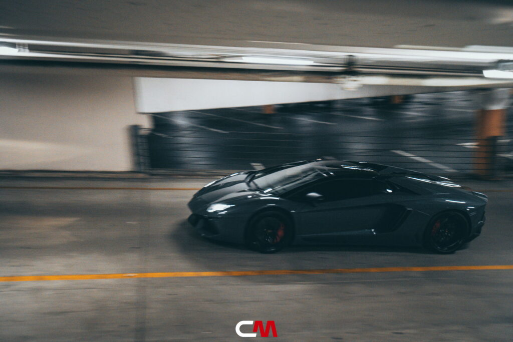 Lamborghini Aventador in a Nardo Gray color-change wrap with black wheels by California Motorsports