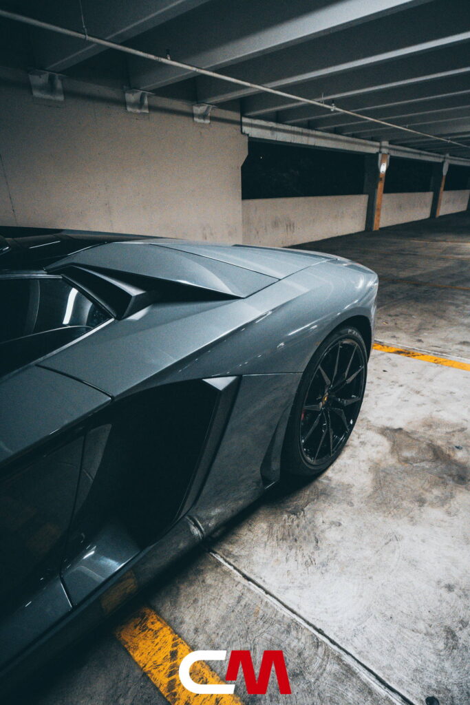 Lamborghini Aventador in a Nardo Gray color-change wrap with black wheels by California Motorsports