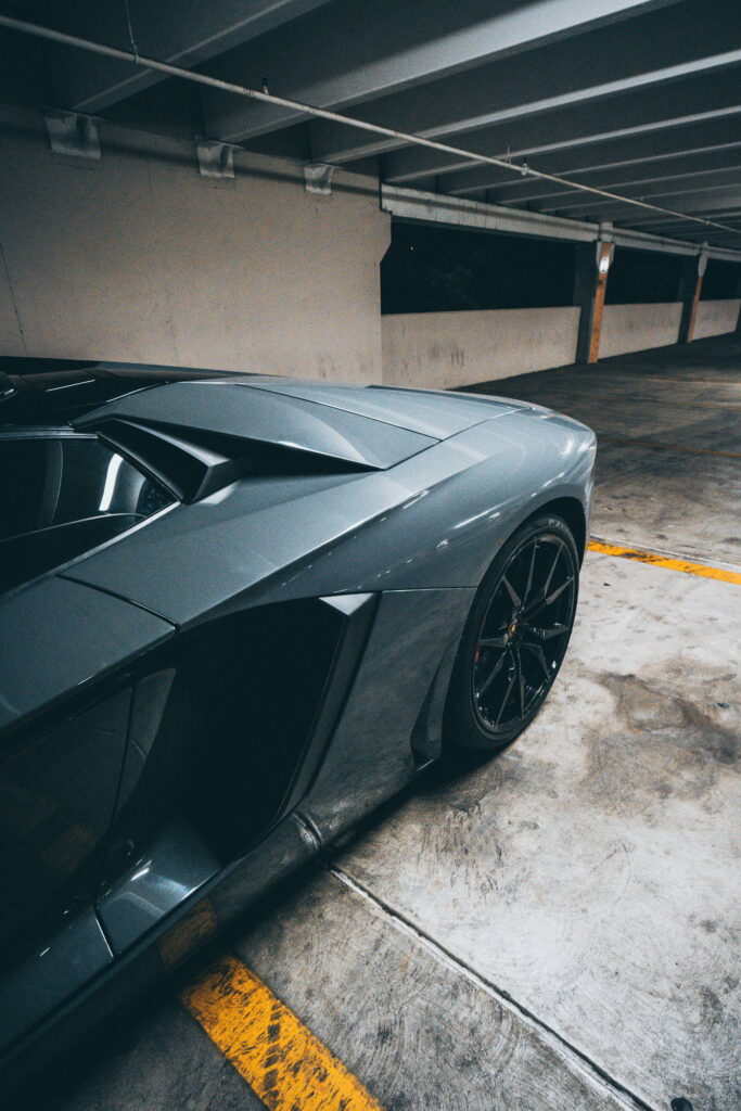Lamborghini Aventador in a Nardo Gray color-change wrap with black wheels by California Motorsports