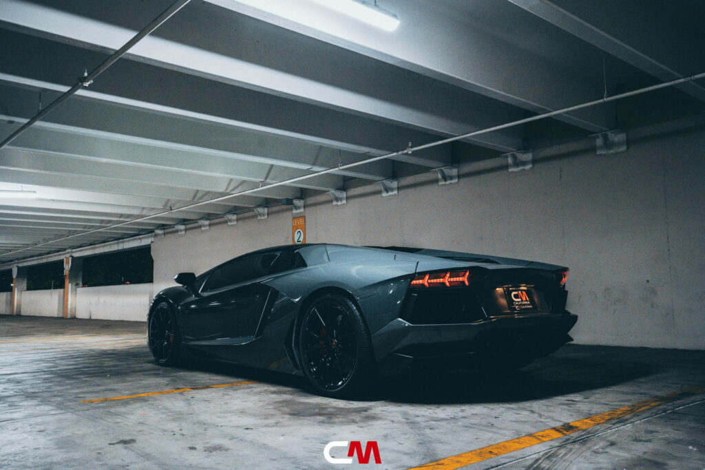 Lamborghini Aventador in a Nardo Gray color-change wrap with black wheels by California Motorsports