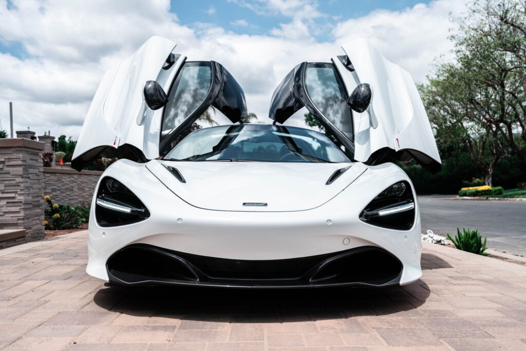 White McLaren 720S with carbon fiber mirror caps and side intake blades fitted by California Motorsports