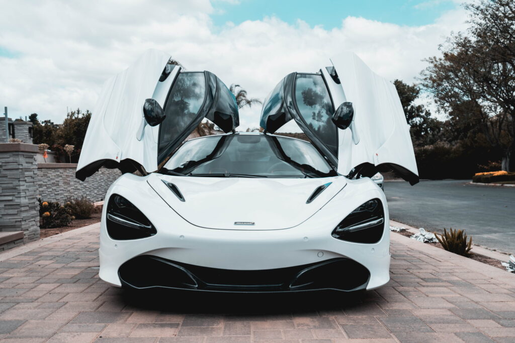 White McLaren 720S with carbon fiber mirror caps and side intake blades fitted by California Motorsports