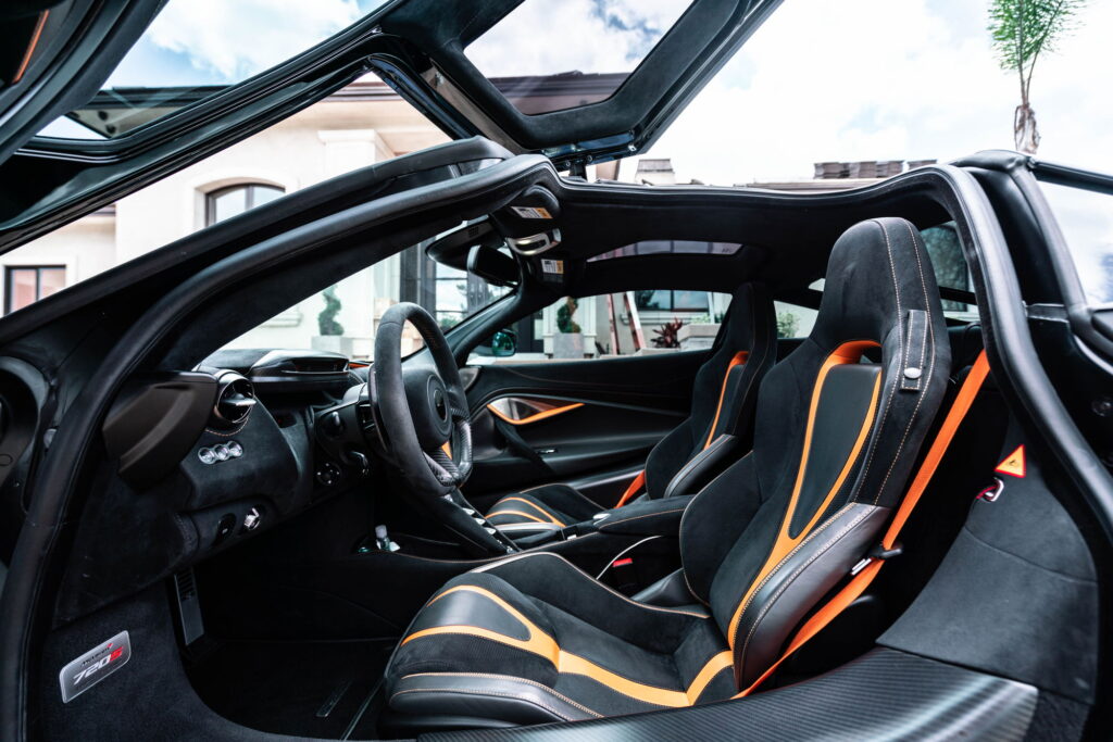 White McLaren 720S with carbon fiber mirror caps and side intake blades fitted by California Motorsports
