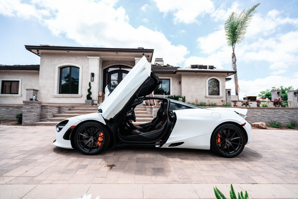 White McLaren 720S with carbon fiber mirror caps and side intake blades fitted by California Motorsports