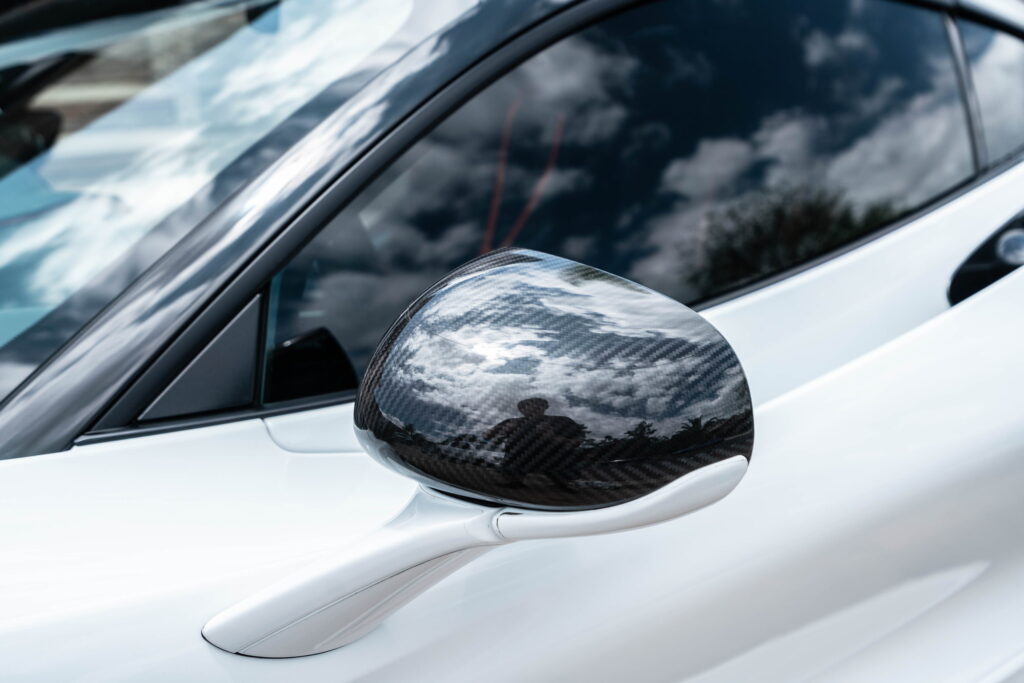 White McLaren 720S with carbon fiber mirror caps and side intake blades fitted by California Motorsports