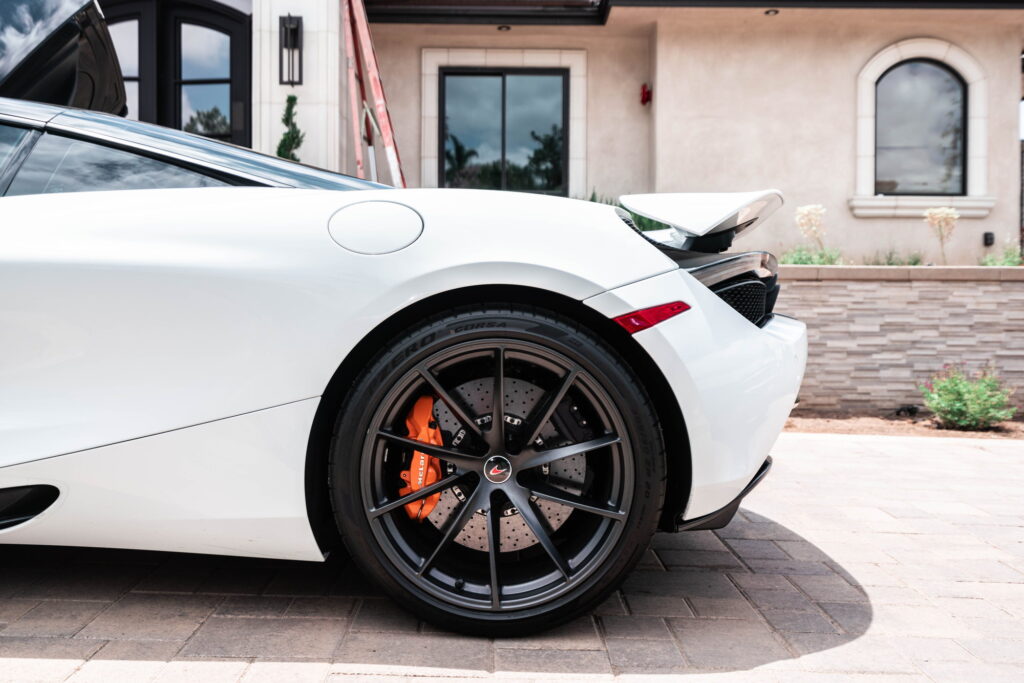 White McLaren 720S with carbon fiber mirror caps and side intake blades fitted by California Motorsports