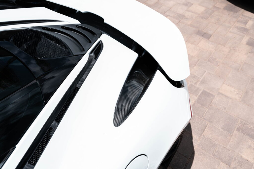 White McLaren 720S with carbon fiber mirror caps and side intake blades fitted by California Motorsports