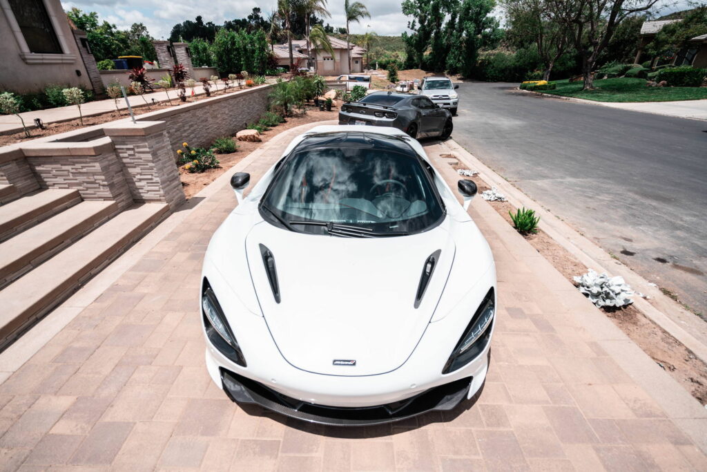 White McLaren 720S with carbon fiber mirror caps and side intake blades fitted by California Motorsports