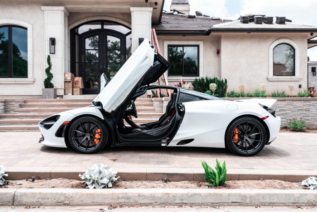 White McLaren 720S with carbon fiber mirror caps and side intake blades fitted by California Motorsports