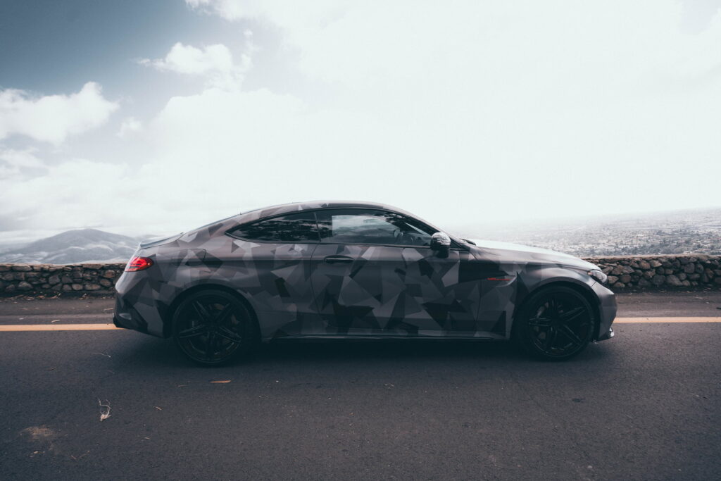 Mercedes-AMG C63 S Coupe in a custom printed camo wrap with red accents by California Motorsports