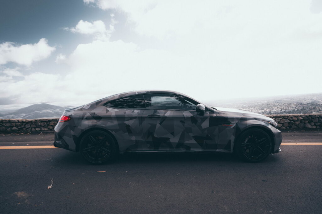 Mercedes-AMG C63 S Coupe in a custom printed camo wrap with red accents by California Motorsports
