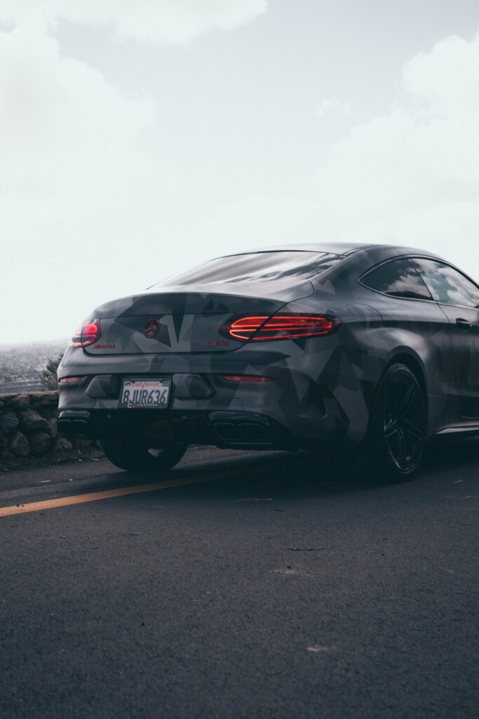 Mercedes-AMG C63 S Coupe in a custom printed camo wrap with red accents by California Motorsports