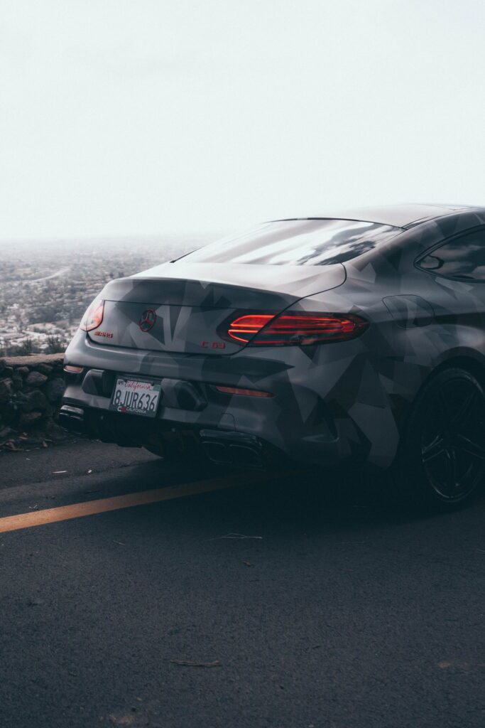 Mercedes-AMG C63 S Coupe in a custom printed camo wrap with red accents by California Motorsports