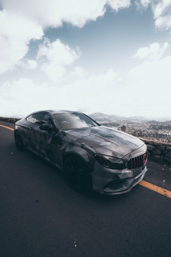 Mercedes-AMG C63 S Coupe in a custom printed camo wrap with red accents by California Motorsports