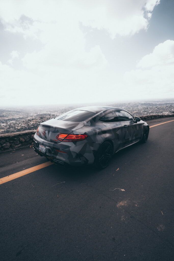 Mercedes-AMG C63 S Coupe in a custom printed camo wrap with red accents by California Motorsports