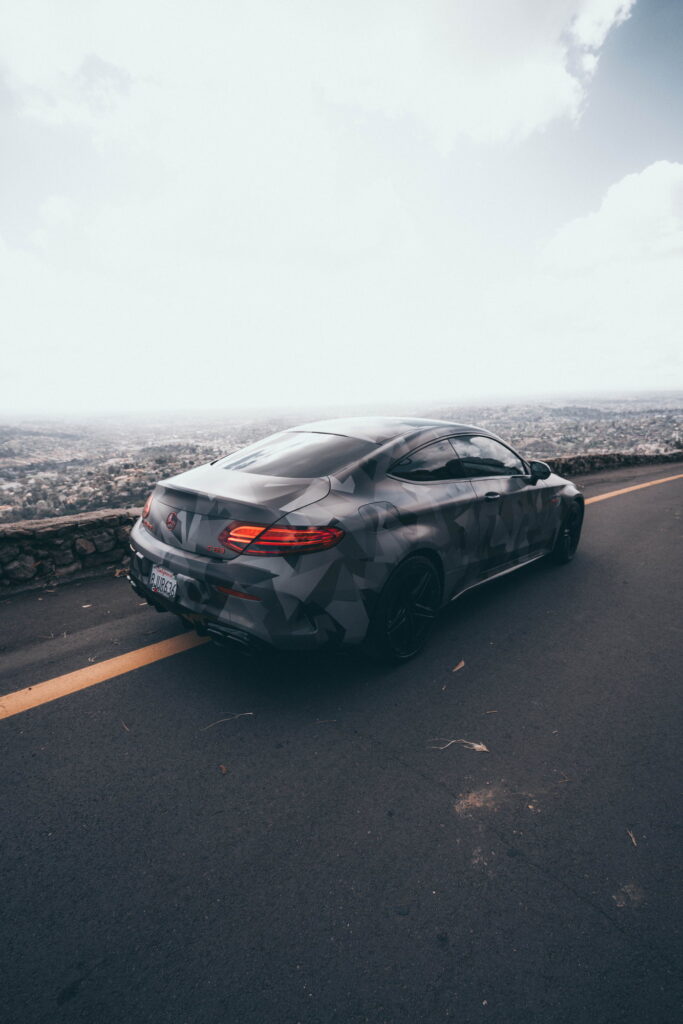 Mercedes-AMG C63 S Coupe in a custom printed camo wrap with red accents by California Motorsports