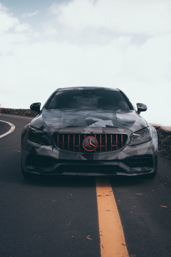 Mercedes-AMG C63 S Coupe in a custom printed camo wrap with red accents by California Motorsports