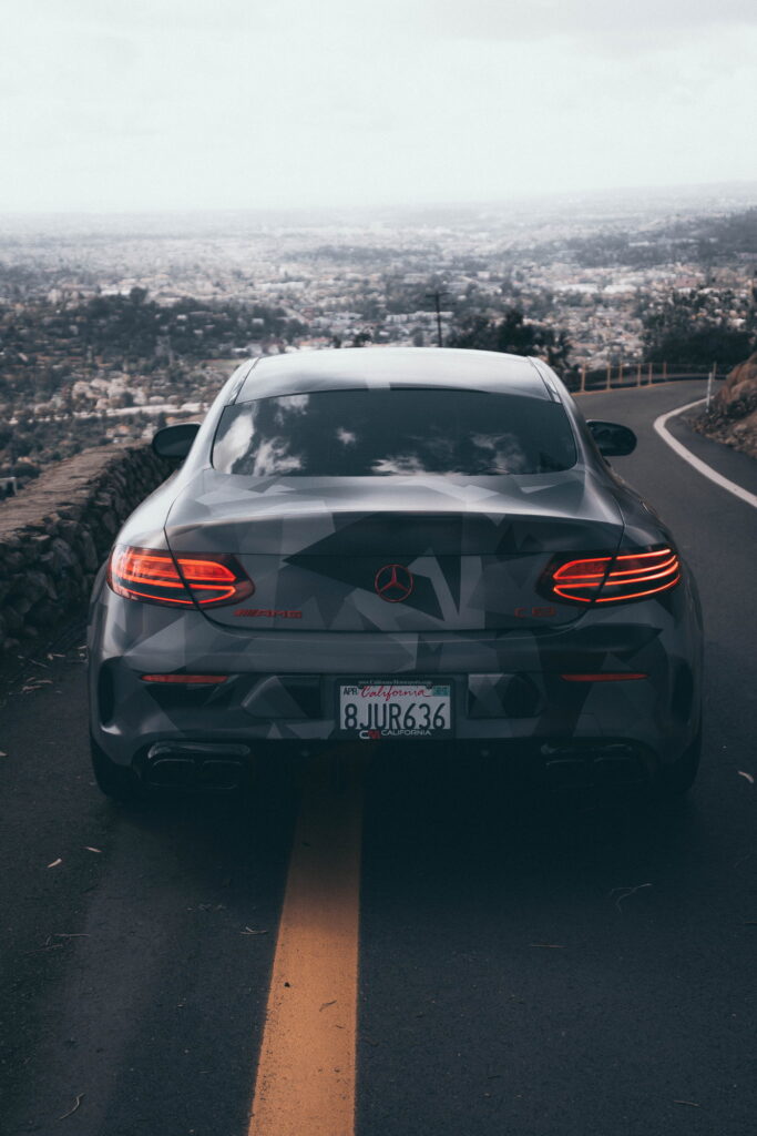 Mercedes-AMG C63 S Coupe in a custom printed camo wrap with red accents by California Motorsports