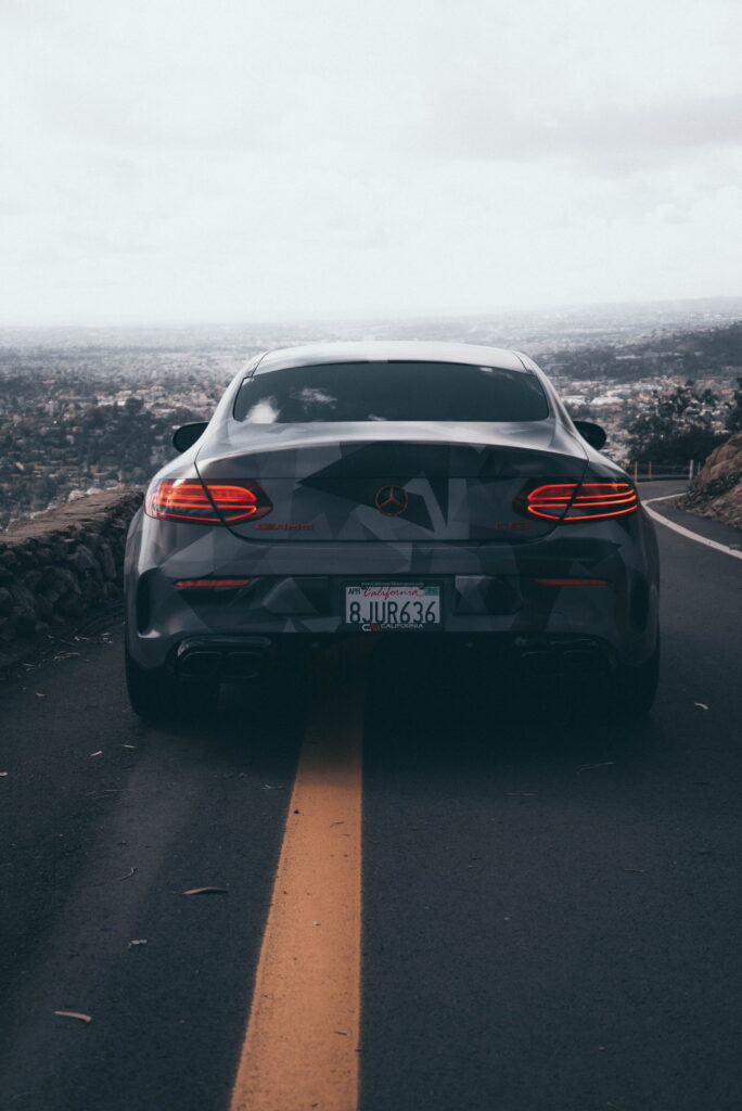 Mercedes-AMG C63 S Coupe in a custom printed camo wrap with red accents by California Motorsports