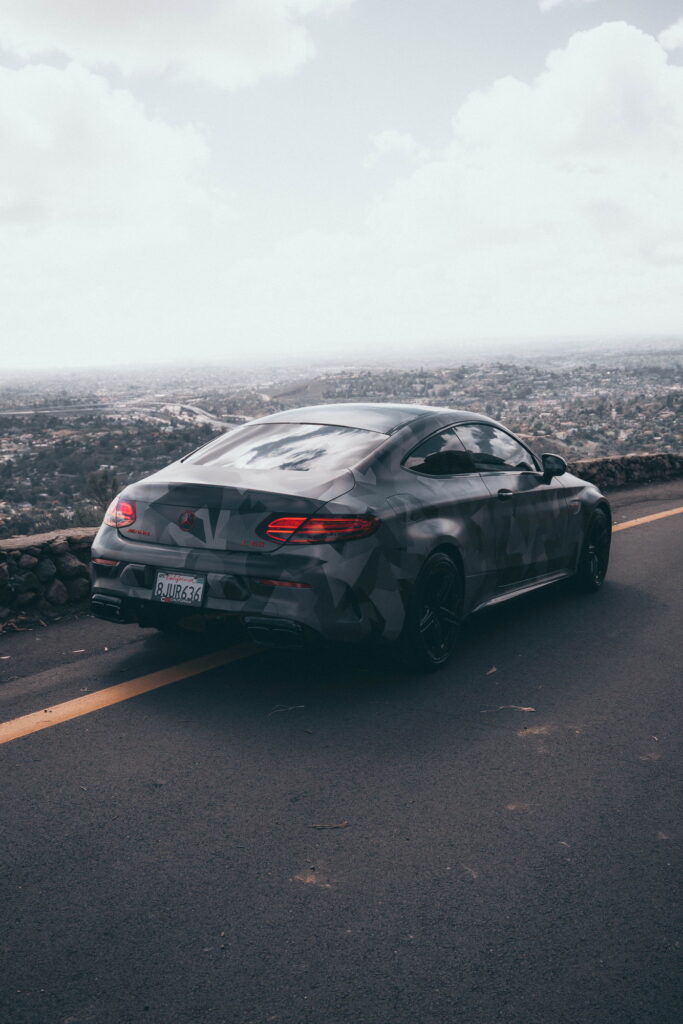 Mercedes-AMG C63 S Coupe in a custom printed camo wrap with red accents by California Motorsports