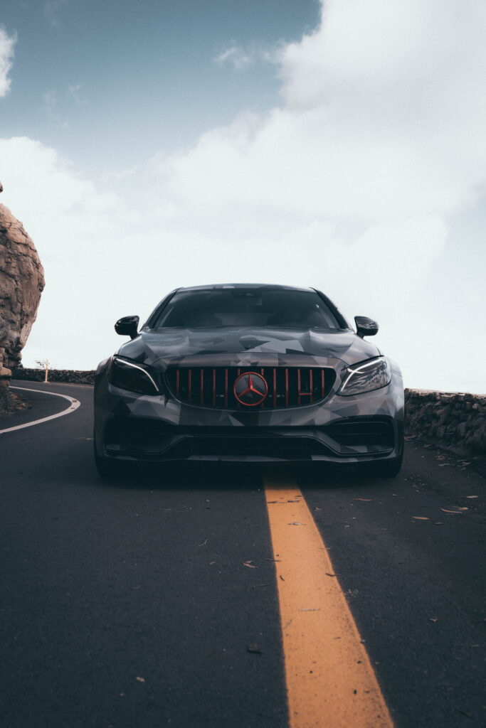 Mercedes-AMG C63 S Coupe in a custom printed camo wrap with red accents by California Motorsports