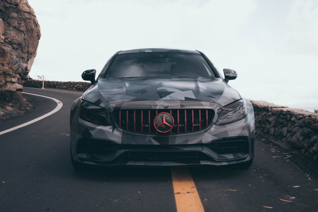 Mercedes-AMG C63 S Coupe in a custom printed camo wrap with red accents by California Motorsports