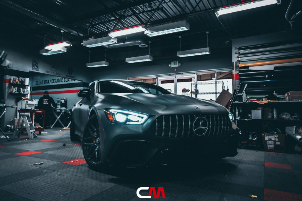 Mercedes-AMG GT 63 4-Door in a custom matte camo wrap being installed at California Motorsports, El Cajon