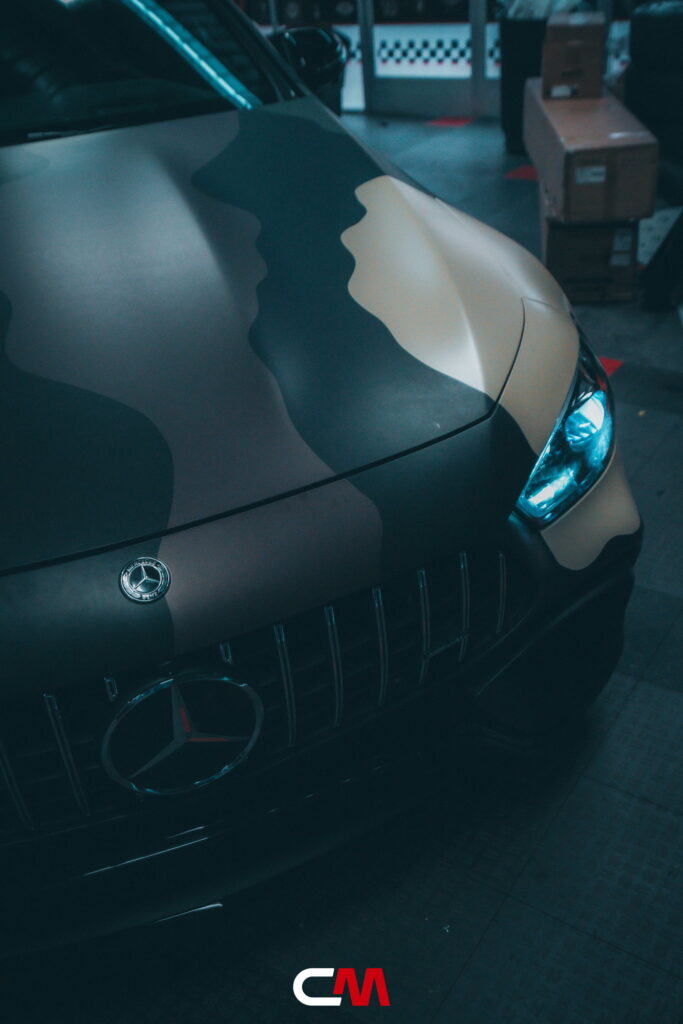 Mercedes-AMG GT 63 4-Door in a custom matte camo wrap being installed at California Motorsports, El Cajon