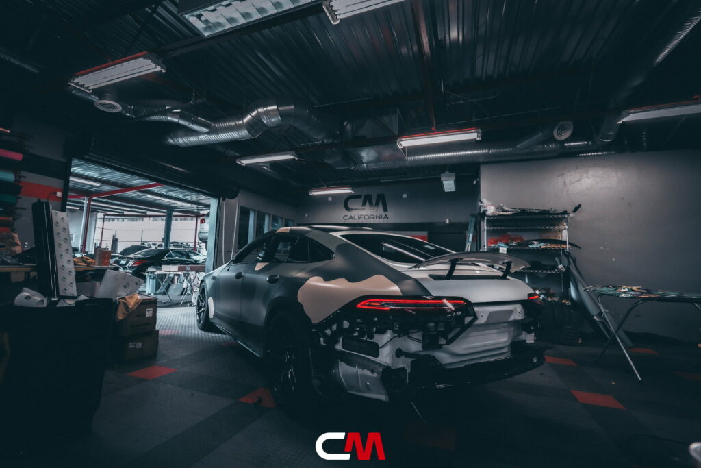 Mercedes-AMG GT 63 4-Door in a custom matte camo wrap being installed at California Motorsports, El Cajon