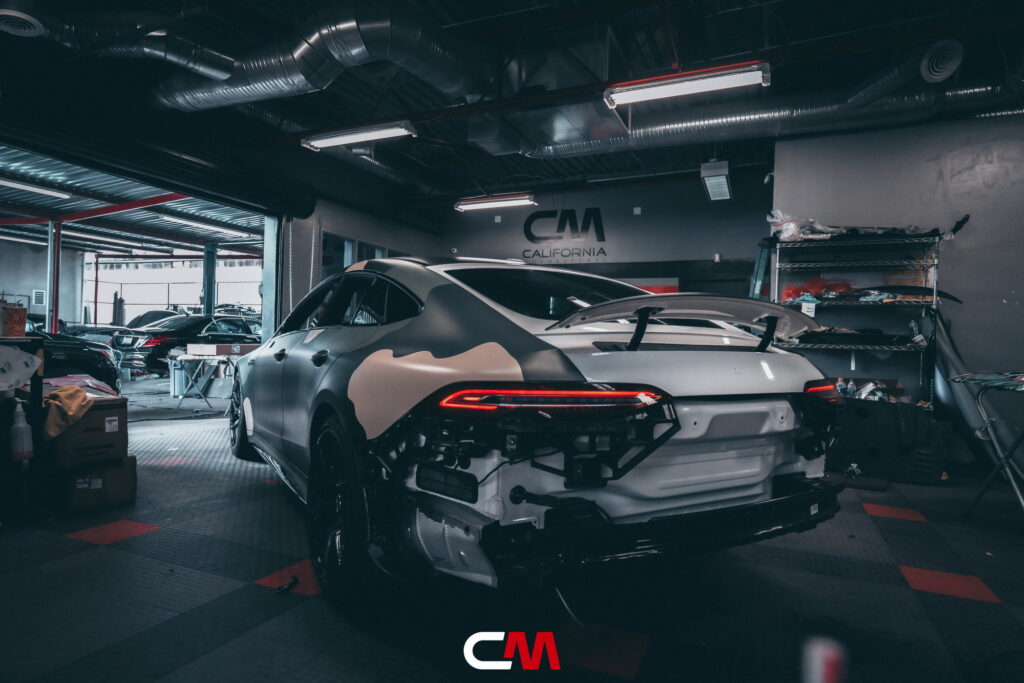 Mercedes-AMG GT 63 4-Door in a custom matte camo wrap being installed at California Motorsports, El Cajon