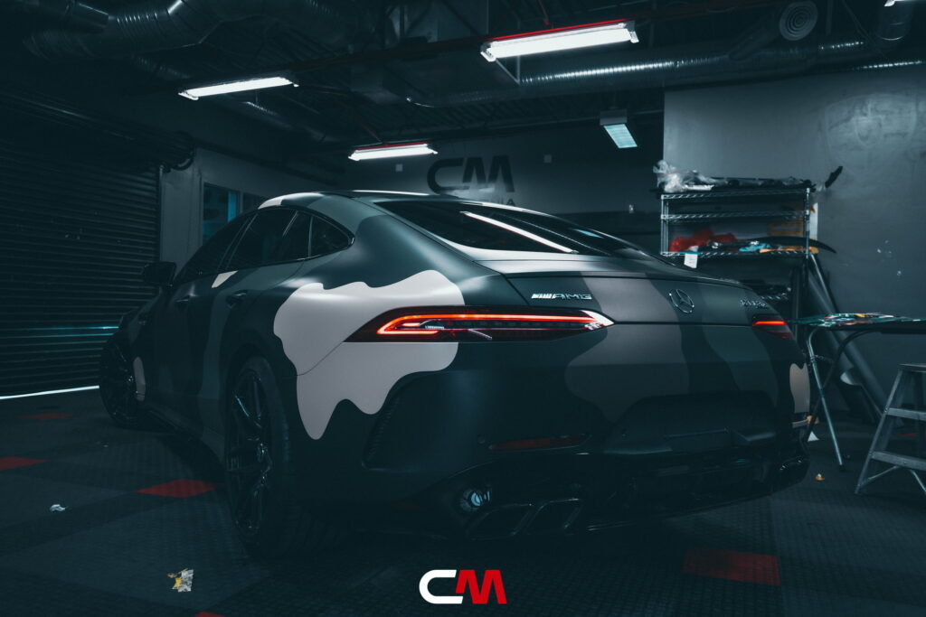 Mercedes-AMG GT 63 4-Door in a custom matte camo wrap being installed at California Motorsports, El Cajon