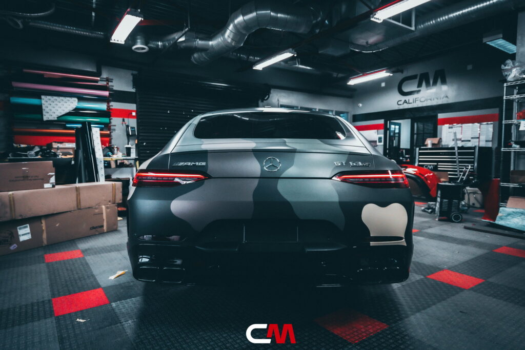 Mercedes-AMG GT 63 4-Door in a custom matte camo wrap being installed at California Motorsports, El Cajon