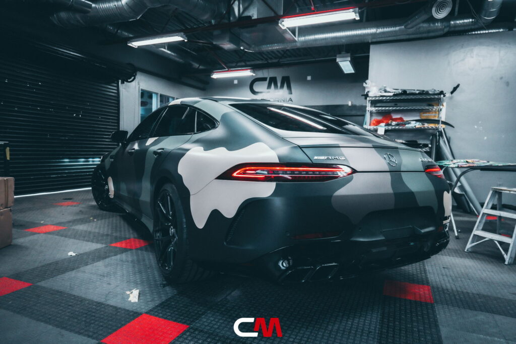 Mercedes-AMG GT 63 4-Door in a custom matte camo wrap being installed at California Motorsports, El Cajon