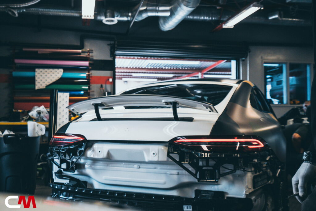 Mercedes-AMG GT 63 4-Door in a custom matte camo wrap being installed at California Motorsports, El Cajon