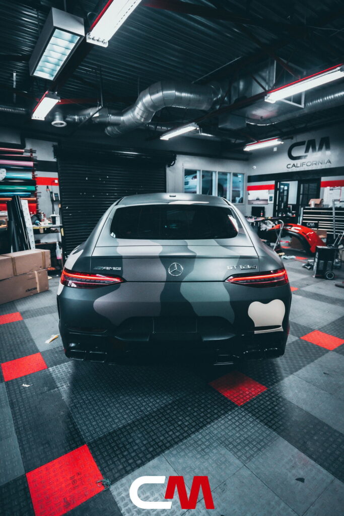 Mercedes-AMG GT 63 4-Door in a custom matte camo wrap being installed at California Motorsports, El Cajon