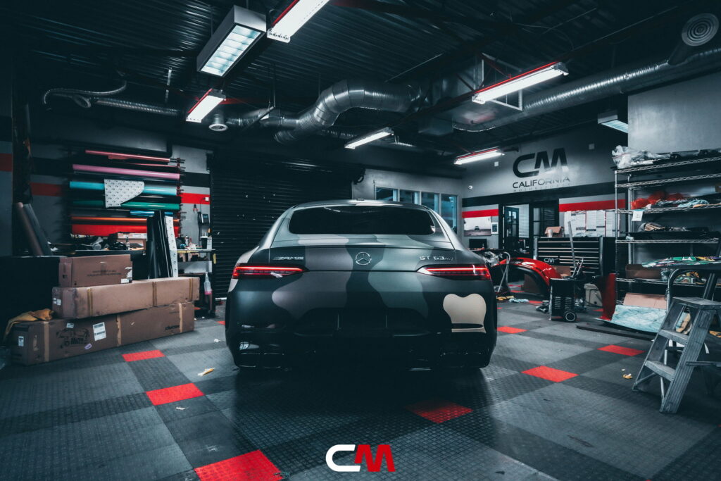 Mercedes-AMG GT 63 4-Door in a custom matte camo wrap being installed at California Motorsports, El Cajon