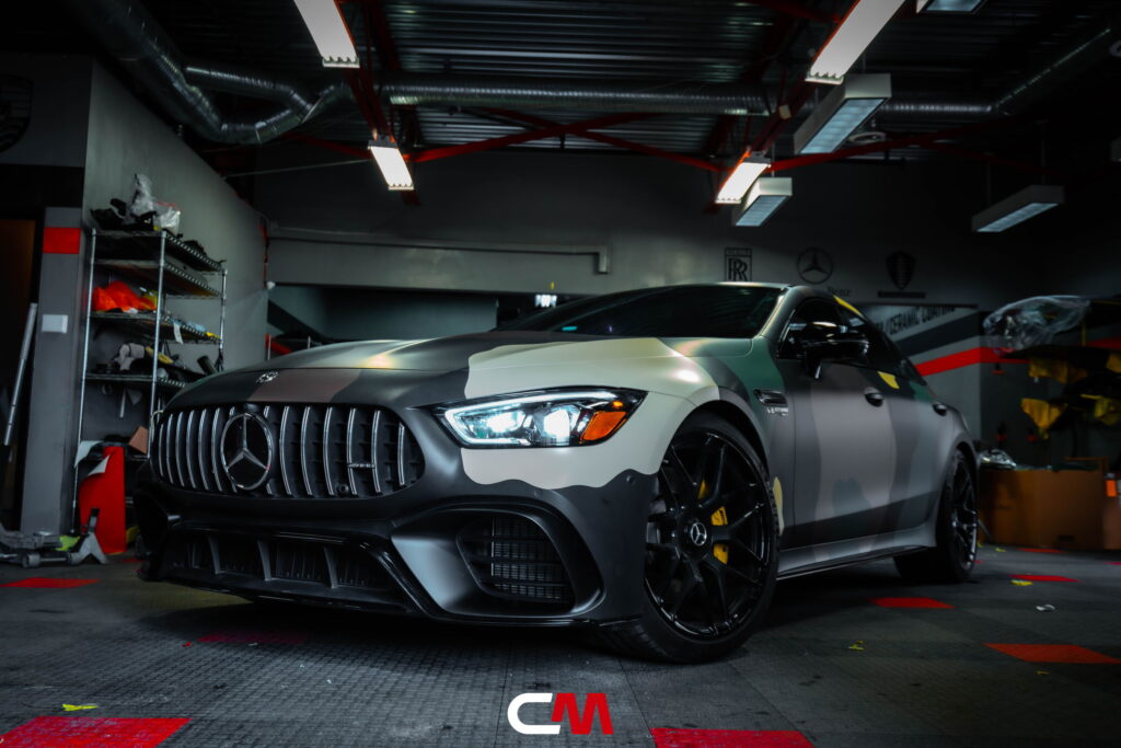 Mercedes-AMG GT 63 4-Door in a custom matte camo wrap being installed at California Motorsports, El Cajon